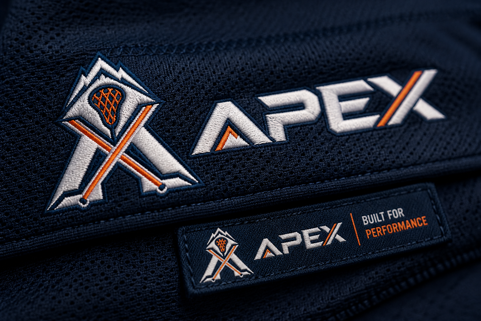 APEX Lacrosse Club — Embroidered crest detail.